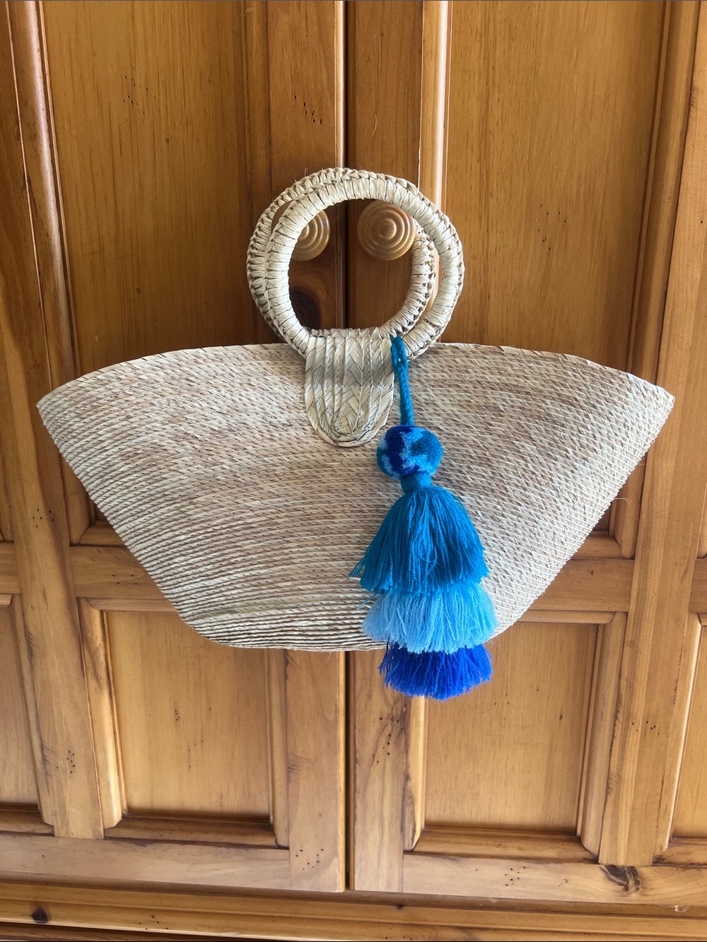 Handmade in Mexico Natural Straw Tote with Blue Tassel Accent